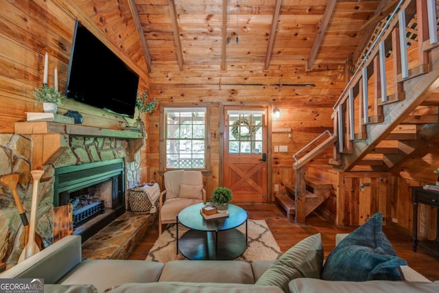 living area featuring wood walls, wood ceiling, and wood finished floors