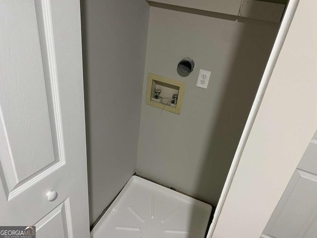 clothes washing area featuring laundry area, washer hookup, and electric dryer hookup