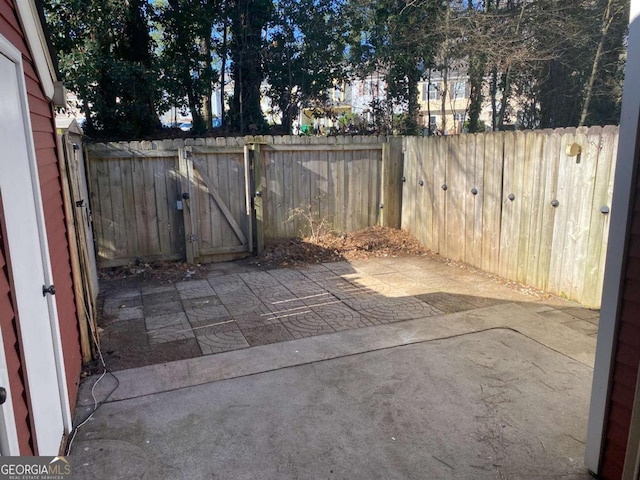 view of patio / terrace with fence and a gate