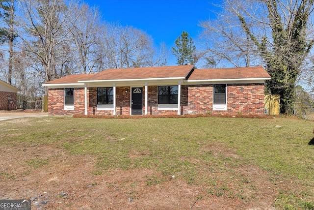 single story home with a front yard and brick siding