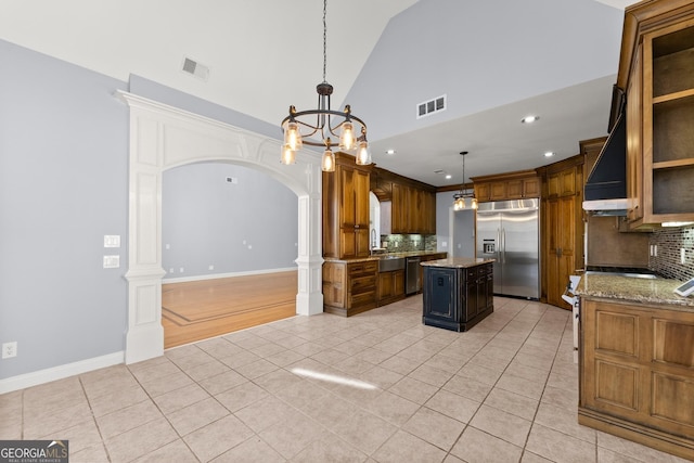 1348 Ewing Creek Dr, Dacula, GA 30019 - kitchen featuring stainless steel appliances, wall chimney exhaust hood, light tile patterned floors, backsplash, and recessed lighting