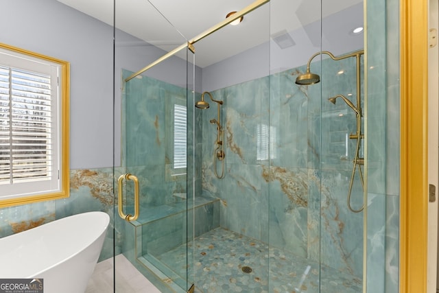 1348 Ewing Creek Dr, Dacula, GA 30019 - full bathroom with healthy amount of natural light, a freestanding bath, and a shower stall