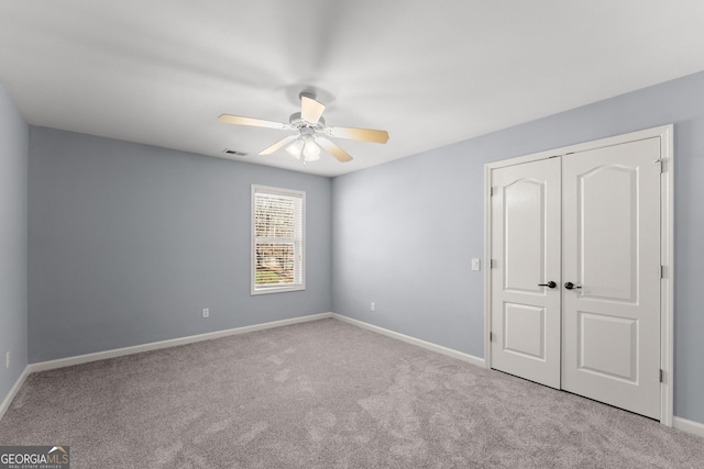 1348 Ewing Creek Dr, Dacula, GA 30019 - unfurnished bedroom with carpet floors, a closet, and ceiling fan