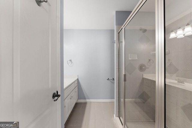 1348 Ewing Creek Dr, Dacula, GA 30019 - bathroom featuring vanity, a shower stall, and tile patterned floors