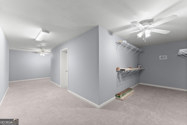 1348 Ewing Creek Dr, Dacula, GA 30019 - walk in closet featuring ceiling fan and carpet