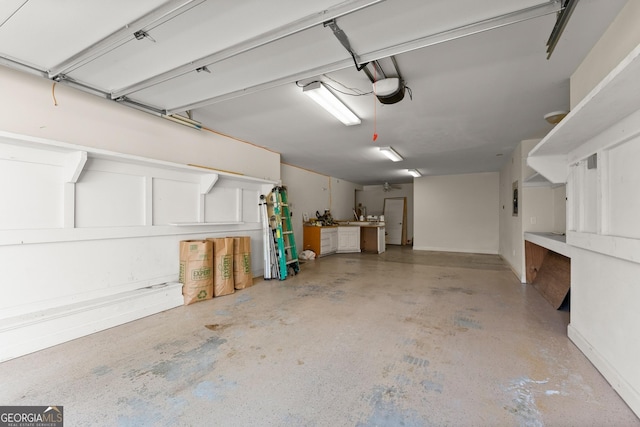 1348 Ewing Creek Dr, Dacula, GA 30019 - garage featuring a garage door opener and electric panel