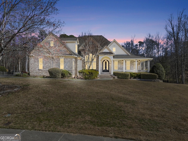 1348 Ewing Creek Dr, Dacula, GA 30019 - traditional home featuring a front yard and covered porch