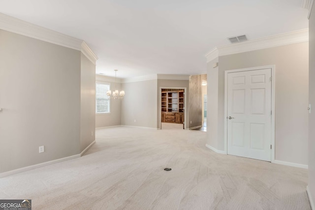 empty room with crown molding, a notable chandelier, visible vents, light colored carpet, and baseboards