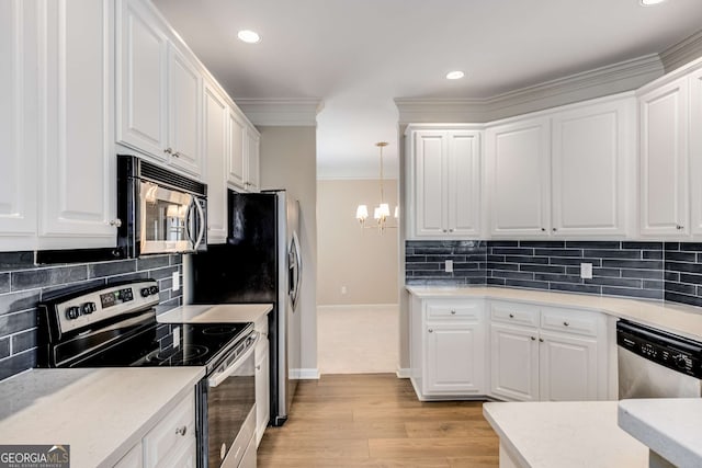 kitchen featuring ornamental molding, appliances with stainless steel finishes, white cabinetry, and light wood-style floors