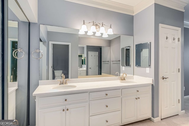 bathroom featuring crown molding, a sink, and double vanity