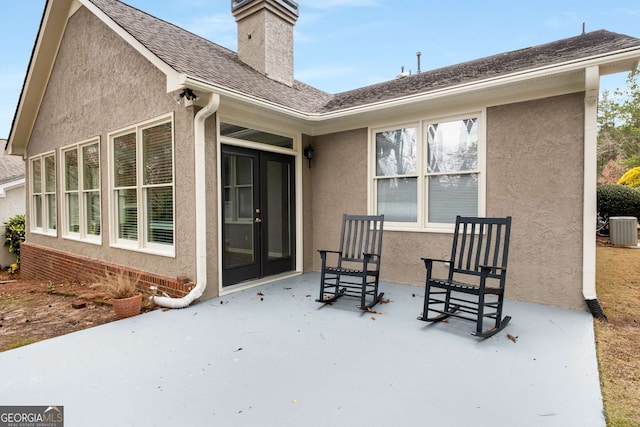 view of patio featuring central air condition unit and french doors