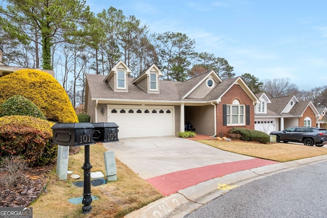 view of front of house with a garage, brick siding, driveway, and a shingled roof