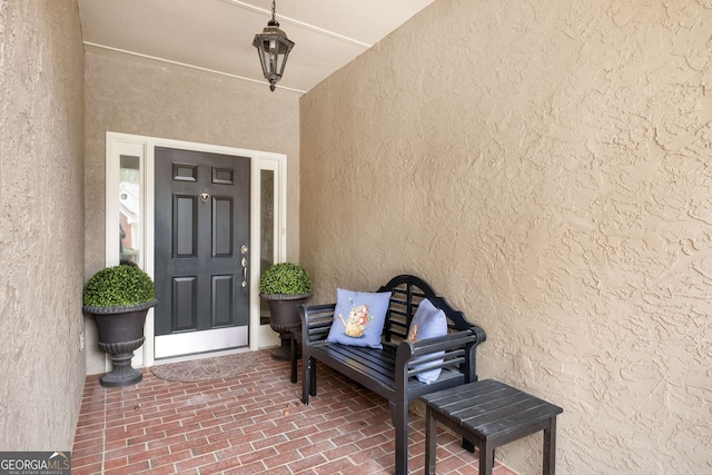 doorway to property with stucco siding