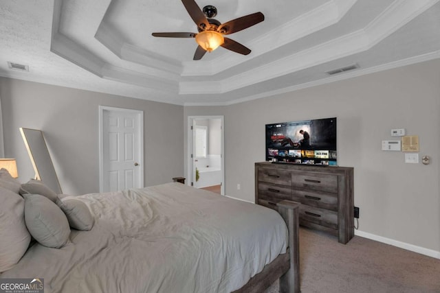 carpeted bedroom with baseboards, visible vents, a raised ceiling, and crown molding