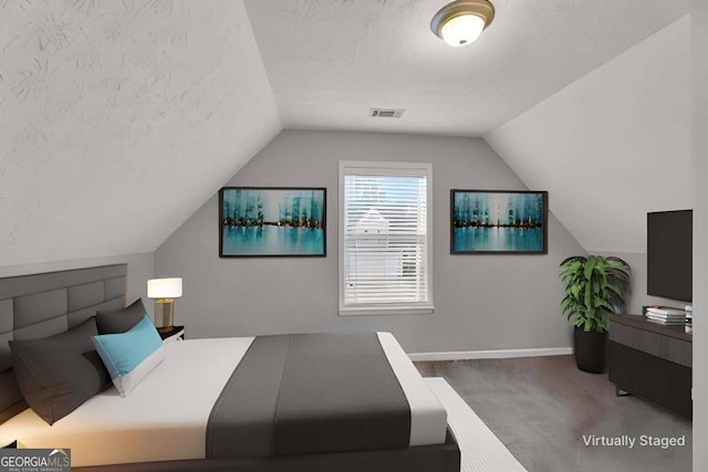 bedroom featuring carpet floors, visible vents, a textured ceiling, and baseboards