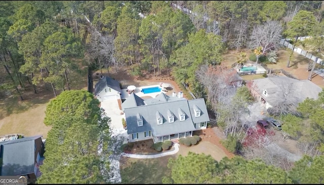 aerial view featuring a view of trees