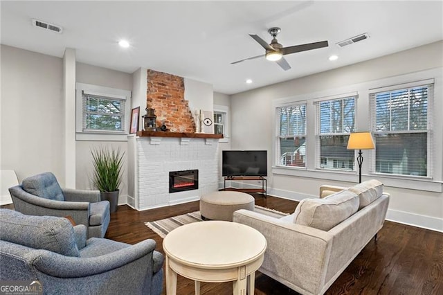942 Byron Dr SW, Atlanta, GA 30310 - living room featuring baseboards, wood finished floors, a fireplace, a ceiling fan, and recessed lighting