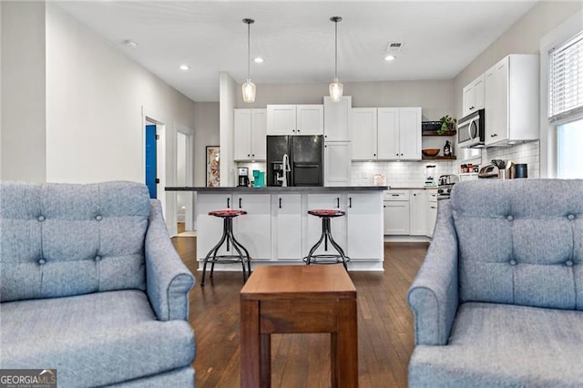 942 Byron Dr SW, Atlanta, GA 30310 - living area featuring dark wood finished floors and recessed lighting