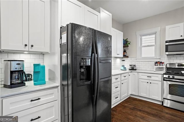 kitchen featuring light countertops, appliances with stainless steel finishes, backsplash, and white cabinets