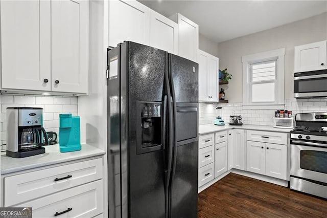 942 Byron Dr SW, Atlanta, GA 30310 - kitchen with stainless steel appliances, tasteful backsplash, and white cabinets
