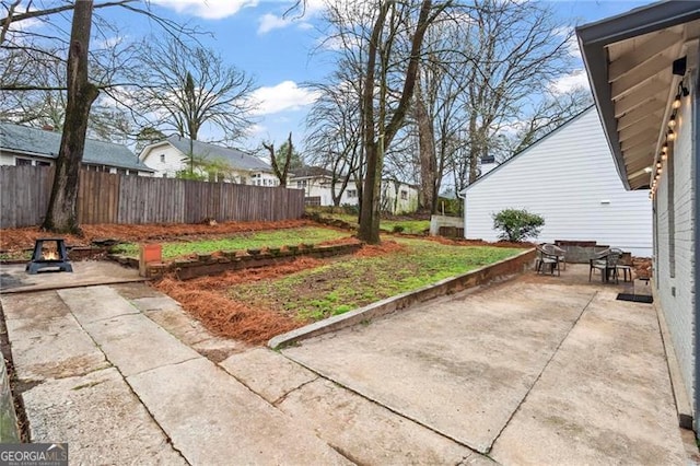 view of yard featuring a patio area and fence