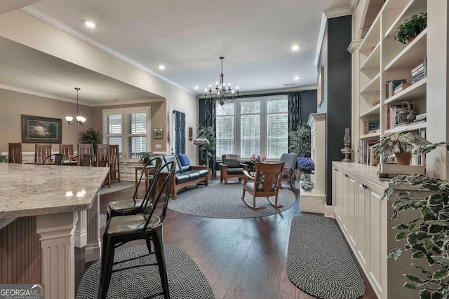 dining area featuring dark wood-style floors, plenty of natural light, and an inviting chandelier