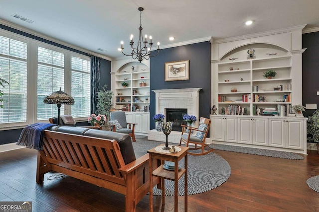 living area with visible vents, dark wood-style floors, ornamental molding, built in shelves, and a fireplace