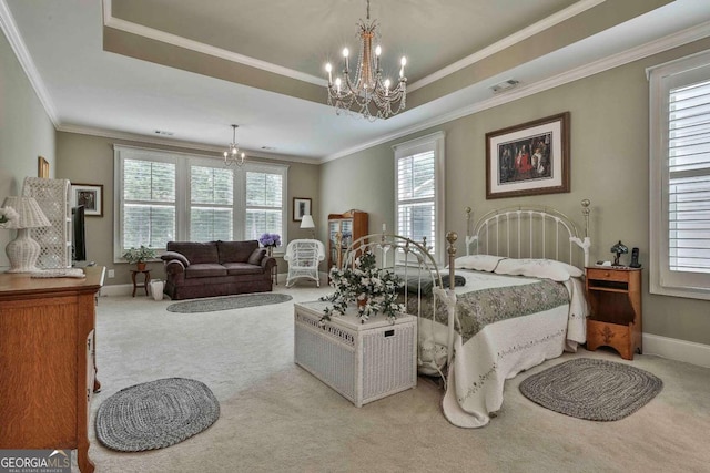 carpeted bedroom featuring baseboards, a tray ceiling, and a notable chandelier