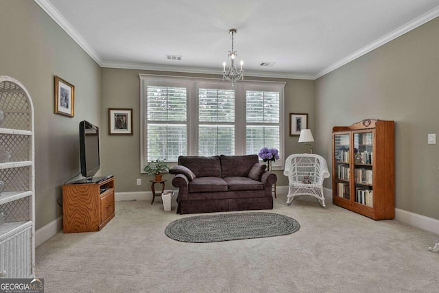 sitting room with a chandelier, ornamental molding, carpet flooring, and baseboards