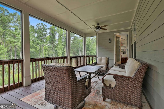 sunroom / solarium with a wealth of natural light and ceiling fan