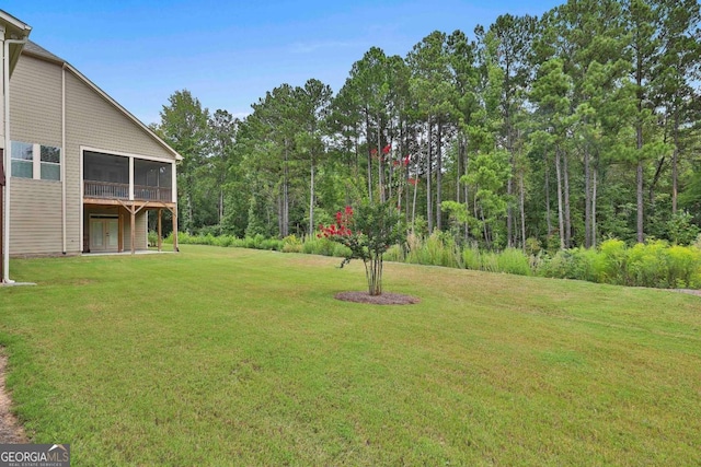 view of yard with a sunroom