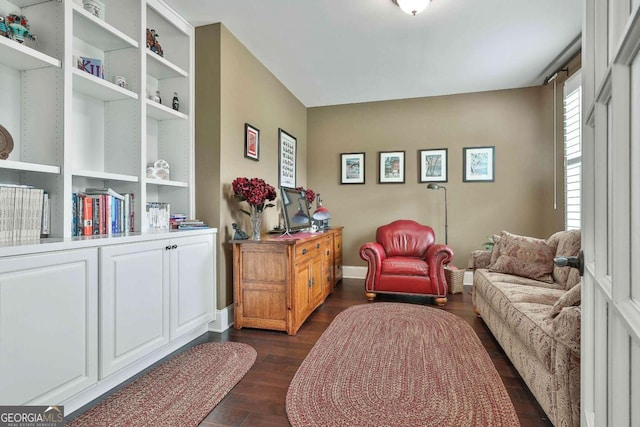 sitting room featuring dark wood finished floors and baseboards