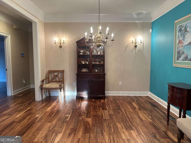 sitting room featuring crown molding, baseboards, and wood finished floors