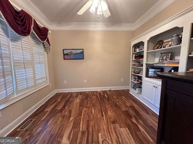 interior space featuring a ceiling fan, visible vents, dark wood-style flooring, and ornamental molding