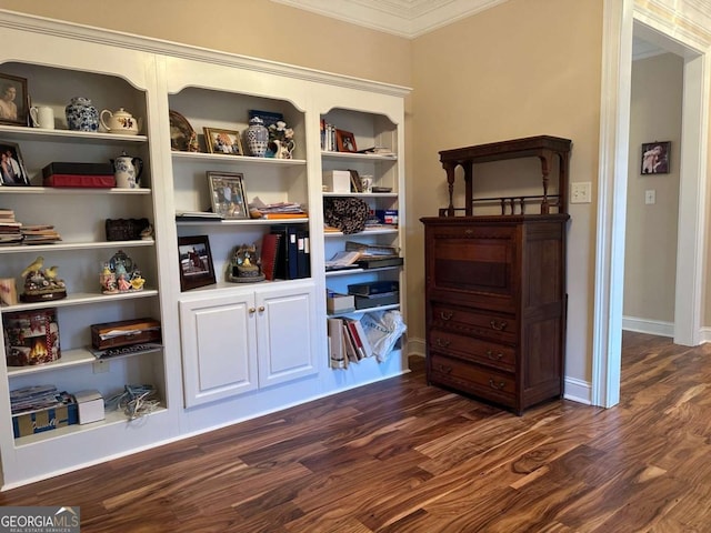 interior space with ornamental molding, dark wood-style flooring, and baseboards