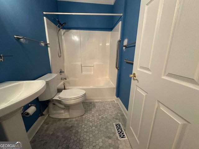 bathroom with toilet, bathing tub / shower combination, visible vents, baseboards, and tile patterned floors