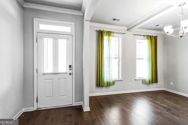 entryway featuring dark wood finished floors, baseboards, visible vents, and a chandelier