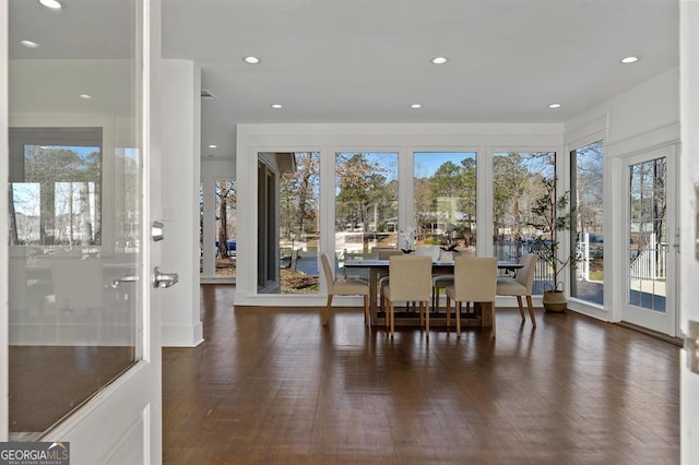 dining room with wood finished floors and recessed lighting