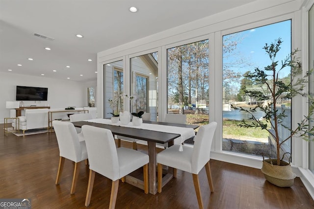 dining space with french doors, dark wood finished floors, visible vents, and recessed lighting