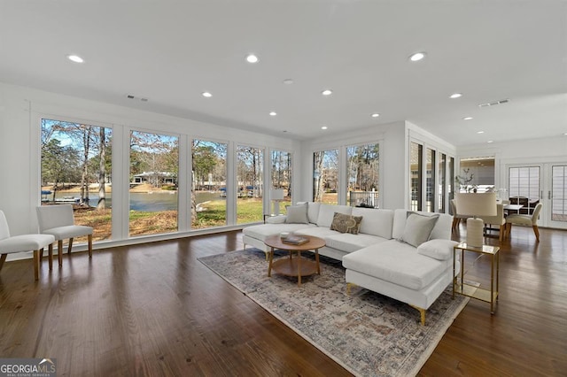 sunroom / solarium with visible vents and a wealth of natural light