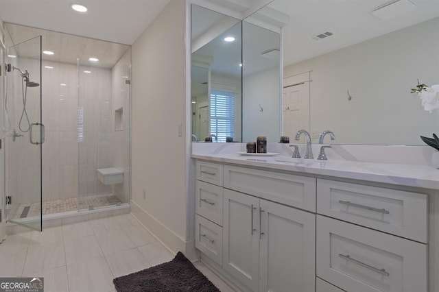 full bathroom with recessed lighting, visible vents, a shower stall, and vanity