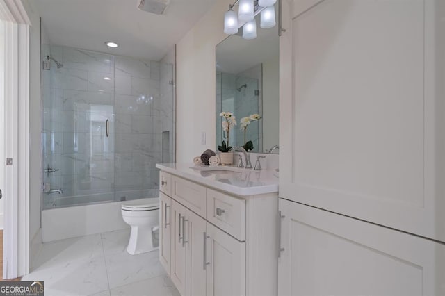 full bathroom with marble finish floor, recessed lighting, toilet, combined bath / shower with glass door, and vanity