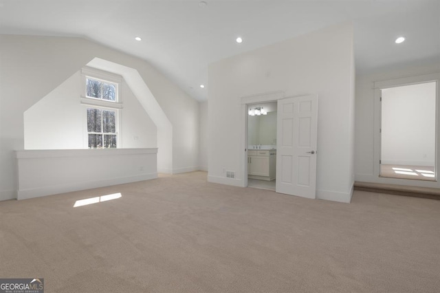 bonus room featuring lofted ceiling, carpet floors, baseboards, and recessed lighting