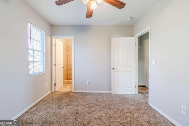 4821 Mainstreet Valley Trce, Stone Mountain, GA 30088 - unfurnished bedroom with carpet, connected bathroom, and a ceiling fan