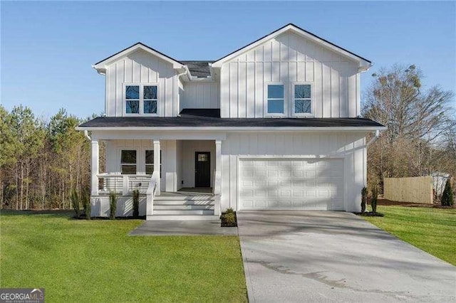 modern farmhouse featuring concrete driveway, an attached garage, covered porch, a front lawn, and board and batten siding