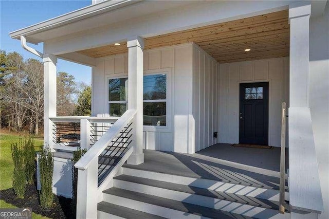 view of exterior entry featuring a porch