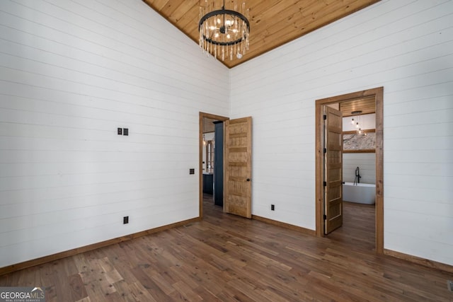 unfurnished bedroom with dark wood-style floors, an inviting chandelier, wood ceiling, high vaulted ceiling, and baseboards