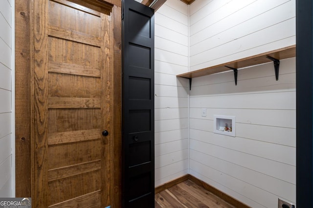 washroom featuring dark wood-style floors, laundry area, and hookup for a washing machine