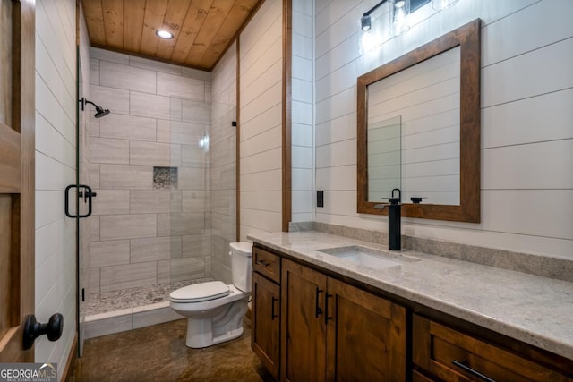 full bath with toilet, a stall shower, wood ceiling, and vanity