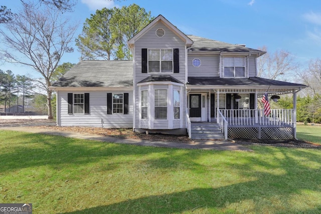 view of front of property featuring a front yard and covered porch